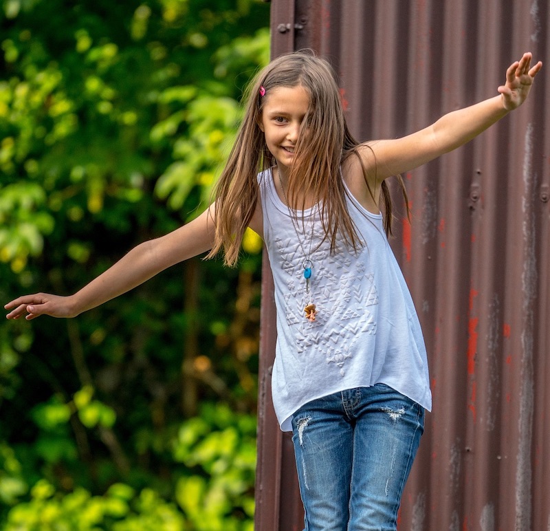 Small girl balancing